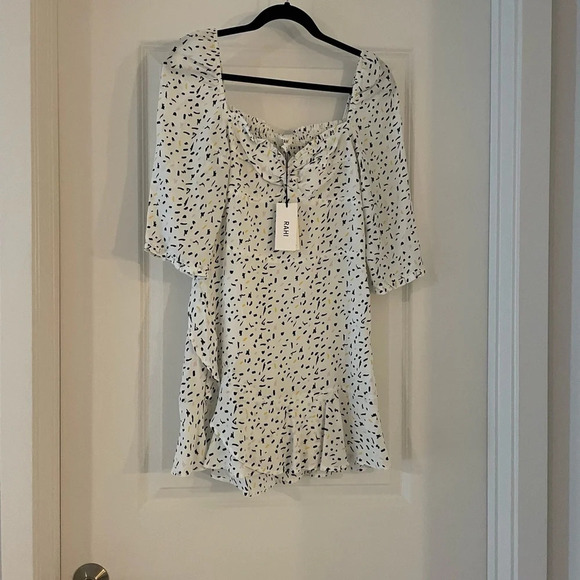 Elegant White and Black Polka Dot Mini Dress - Picture 5 of 8